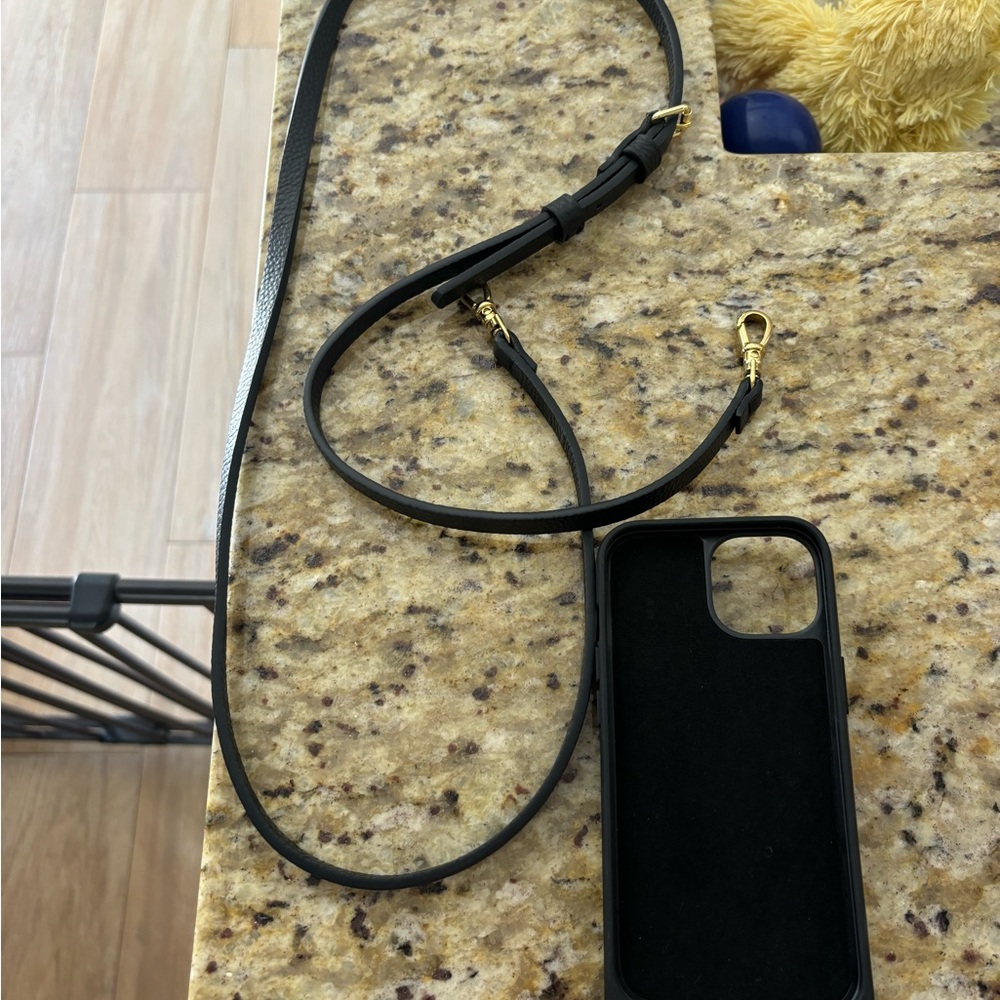 Bandolier iPhone 15 case with strap / crossbody purse.